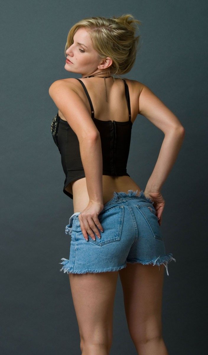 blonde girl strips her black corset