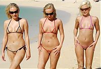 Babes: three young blonde girls wearing extreme bikini on the beach
