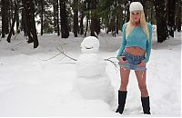 Babes: young blonde girl with a snowman outside in the winter