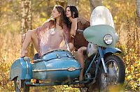 Babes: two young girls posing on the old sidecar