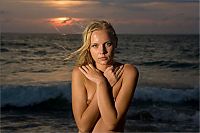 Babes: young blonde girl in the sea at sunset