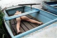 Babes: brunette girl posing in the old boat