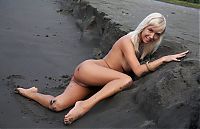 Nake.Me search results: young swedish blonde girl on the sand and mud bank with a driftwood and remains of trees