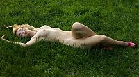 Babes: young blonde girl strips on the grass in the village