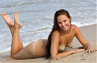 Nake.Me search results: cute young brunette girl reveals on the beach with a seashell