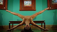 Nake.Me search results: brunette girl doing gymnastic exercises in the church with stained glass windows