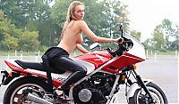 Nake.Me search results: blonde girl undresses her leather overall on the honda motorcycle