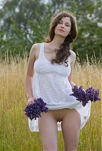 Nake.Me search results: young curly brunette girl in the nature on the field of wild flowers