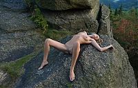 Nake.Me search results: cute young blonde girl with a navel piercing posing naked on rocks in high mountains